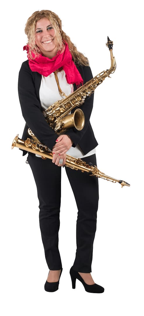female musician playing trumpet and brass instruments 